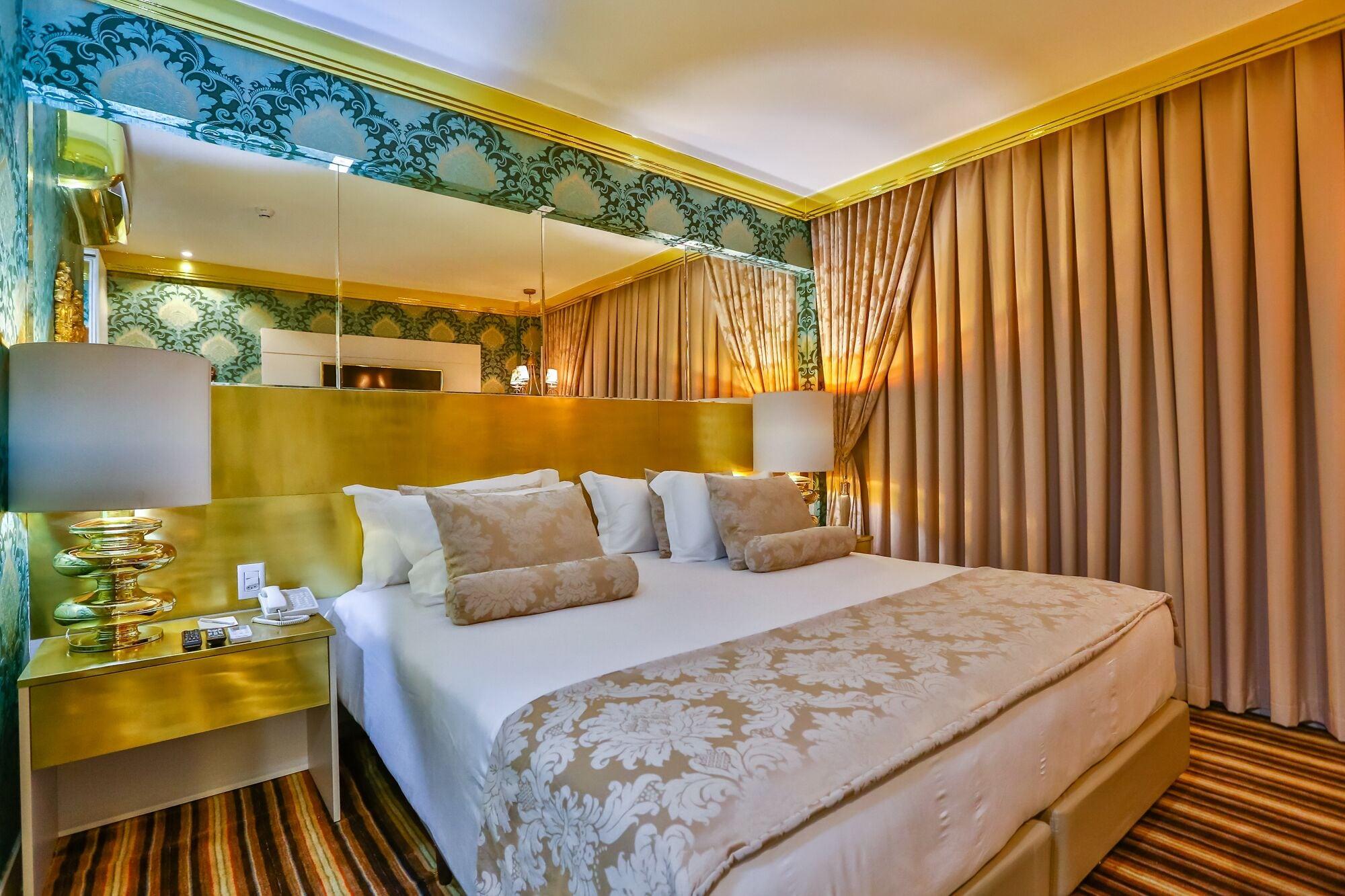 Golden Lis Hotel Boutique جويانيا المظهر الخارجي الصورة A bedroom at the hotel